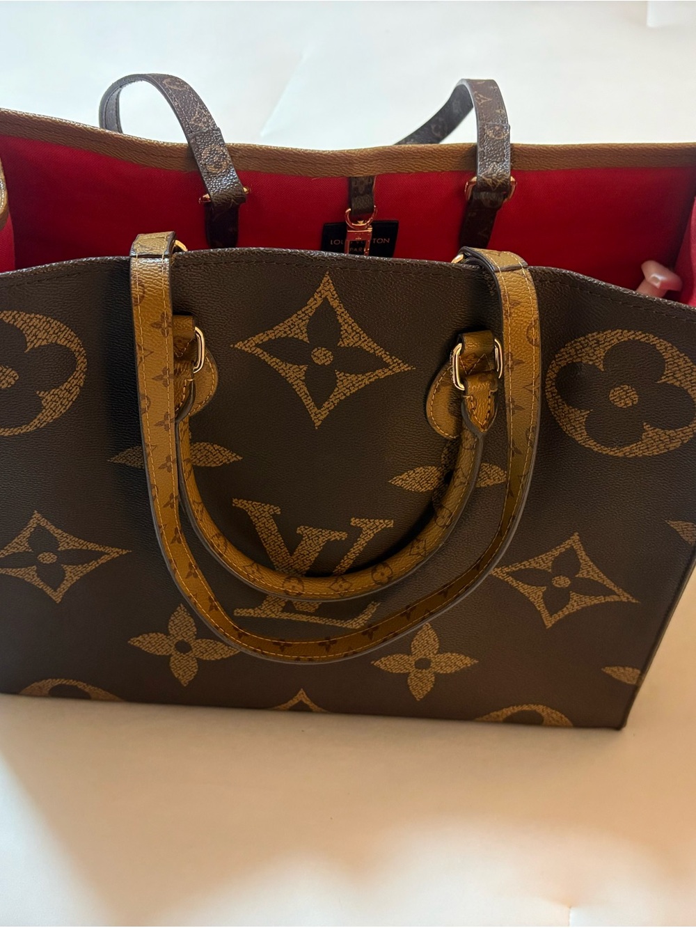 Fashion purse. Monogram Large Tote in Tan/Brown with Red Interior